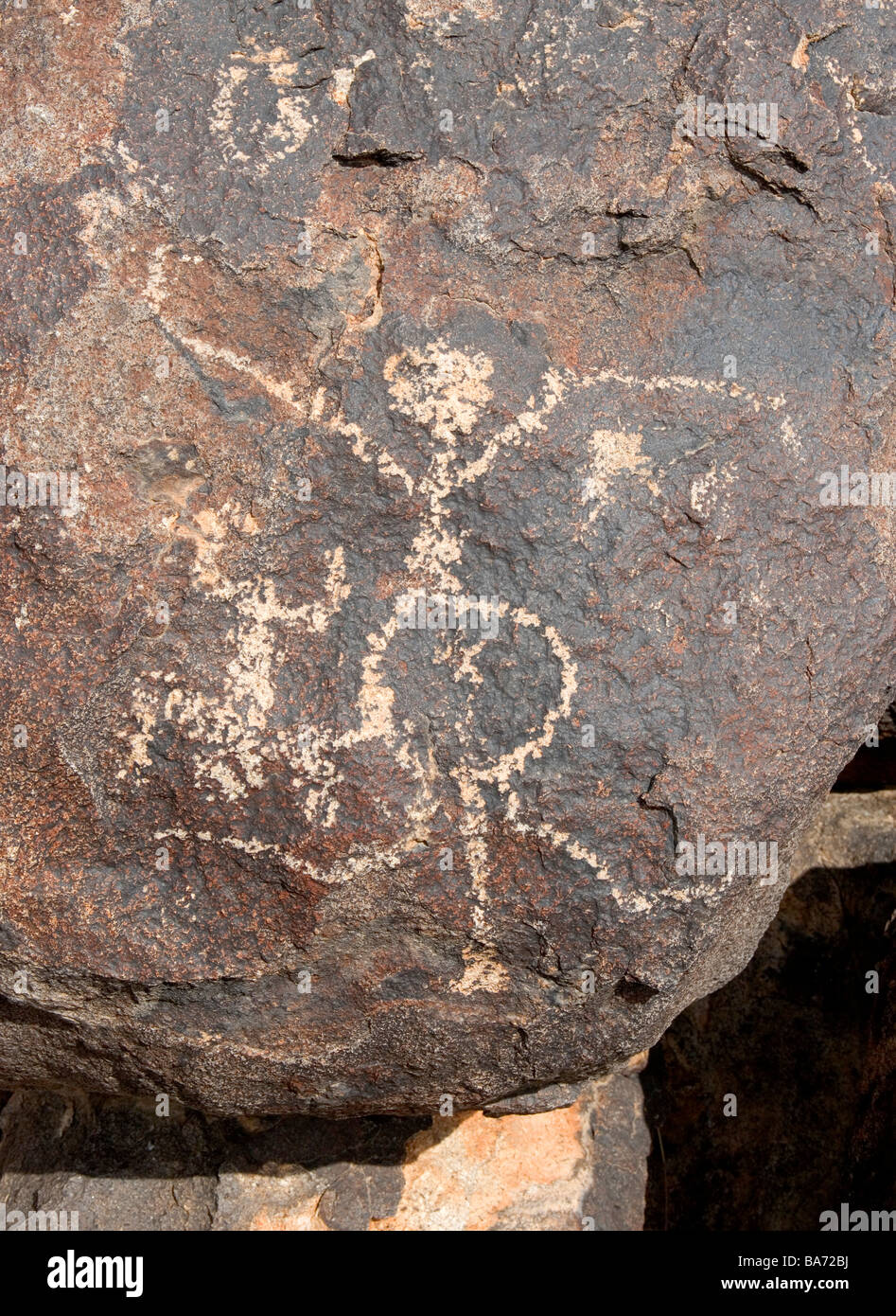 An ancient Hohokum Indian Petroglyph of a pregnant mother and newborn baby This art is located at Picacho Peak Arizona. Stock Photo