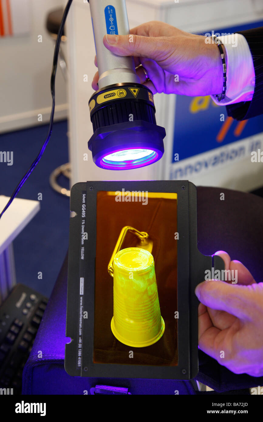 Fingerprints seen with an UV-light torch for police crime scene investigation, IPOMEX, Munster, Germany. Stock Photo