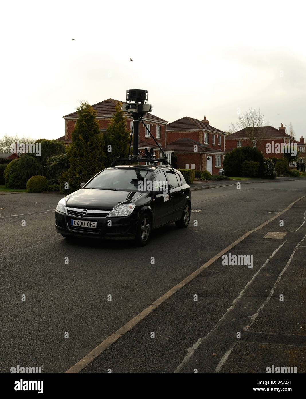 Google streetview car films in a residential street, Stock Photo