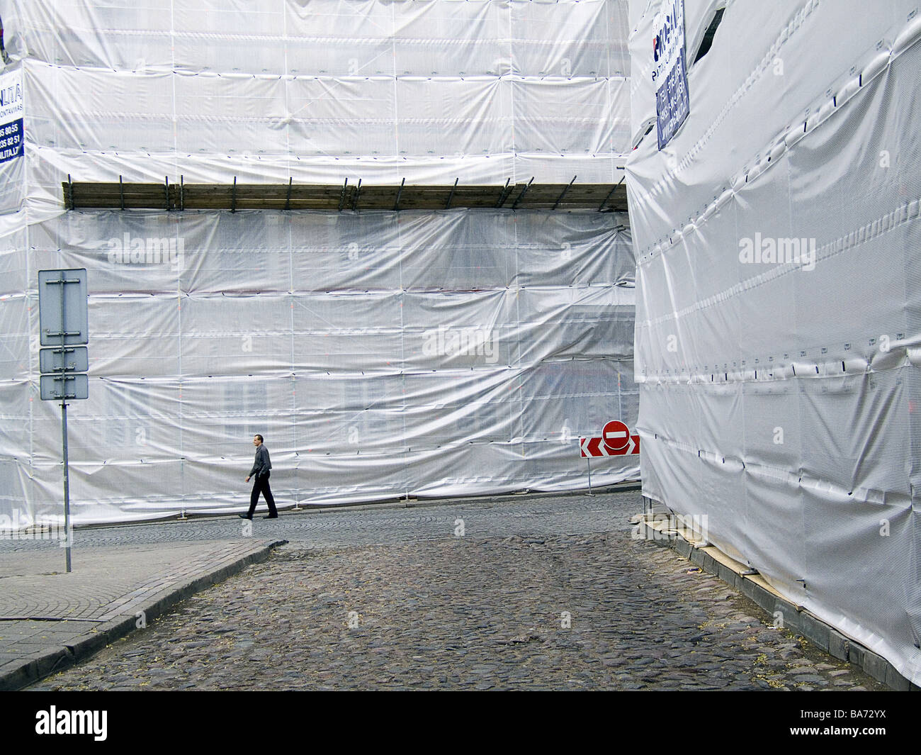 Goes man street building facades construction works cloaks detail ...