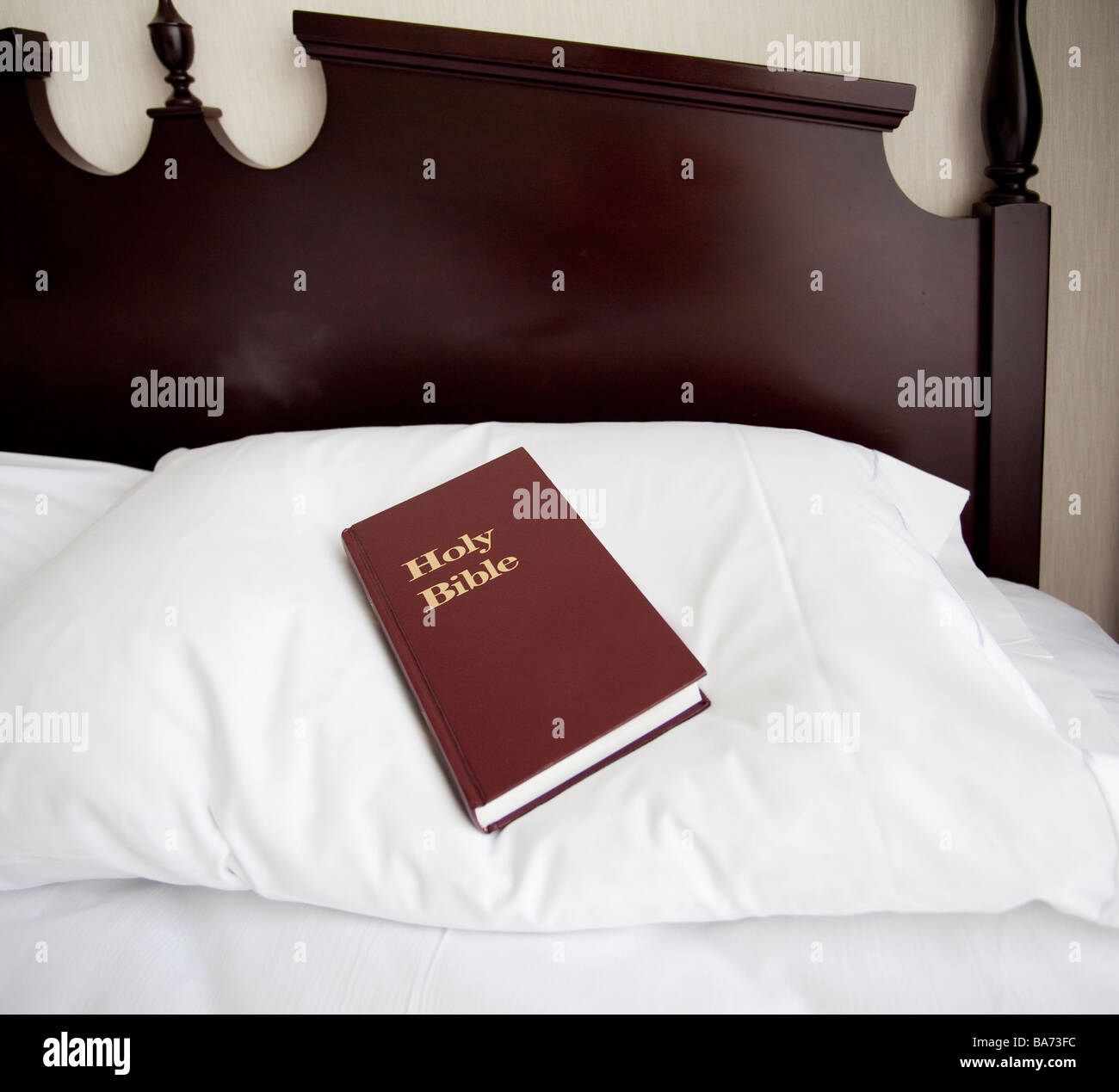 bible on hotel room bed Stock Photo Alamy