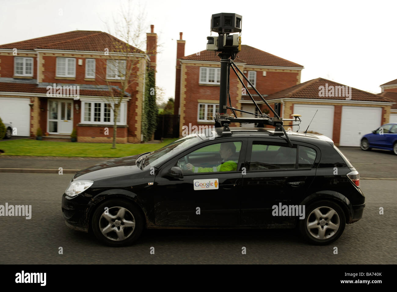 Google streetview car films in a residential street Stock Photo