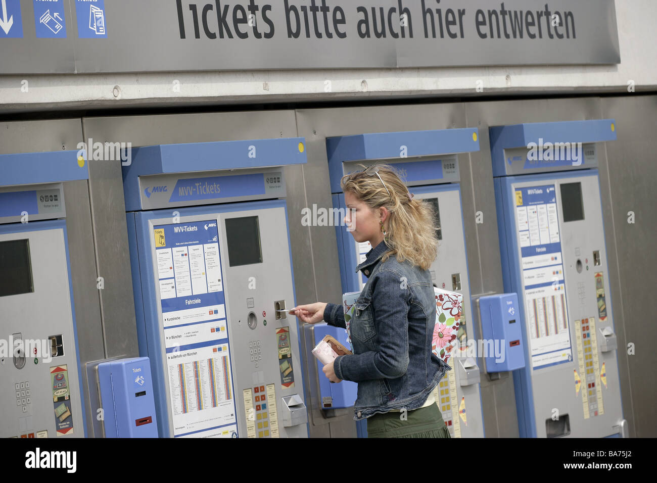 Debase woman young ticket vending machines Stock Photo - Alamy