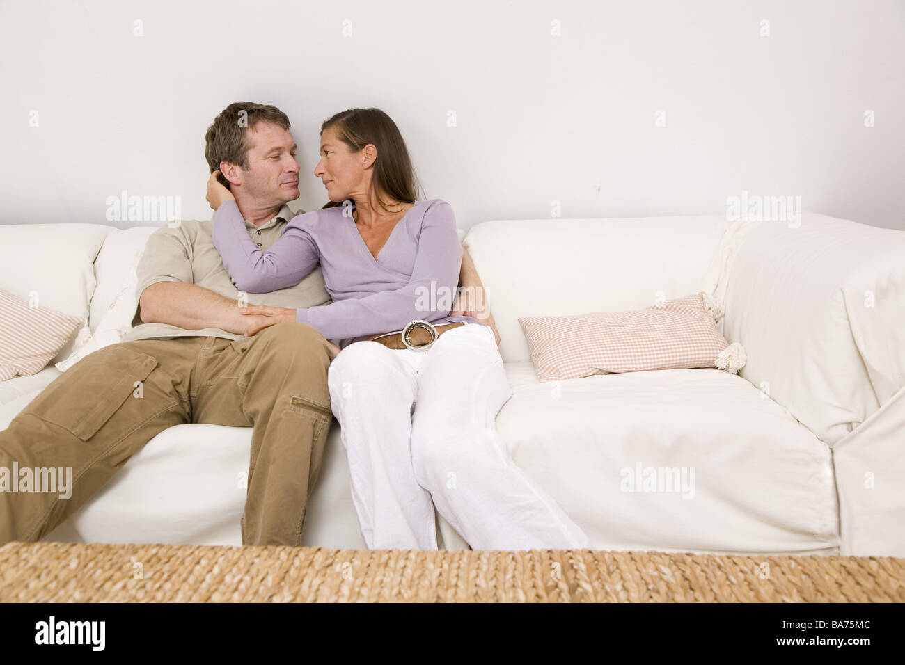 Living rooms couch pair falls in love embrace gazecontact apartment