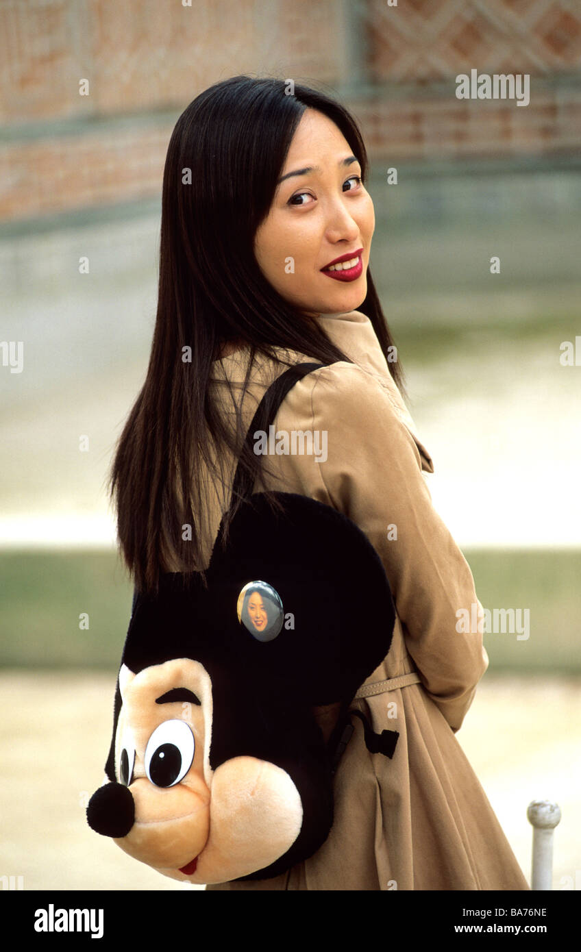 South Korea, Seoul, young Korean woman carrying a Mickey rucksack Stock Photo