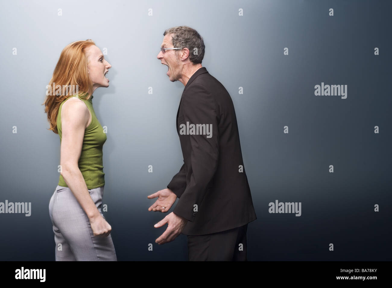 Mate dispute screams stands opposite at the side series people two 20-30 years 40-50 years ages old-age-difference adults Stock Photo