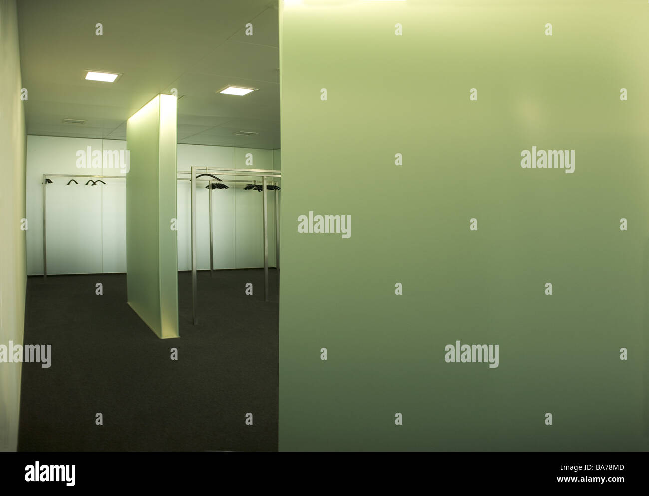 Cloakroom empty office cloakroomarea light greenish nobody cool bald design hangers coat stands