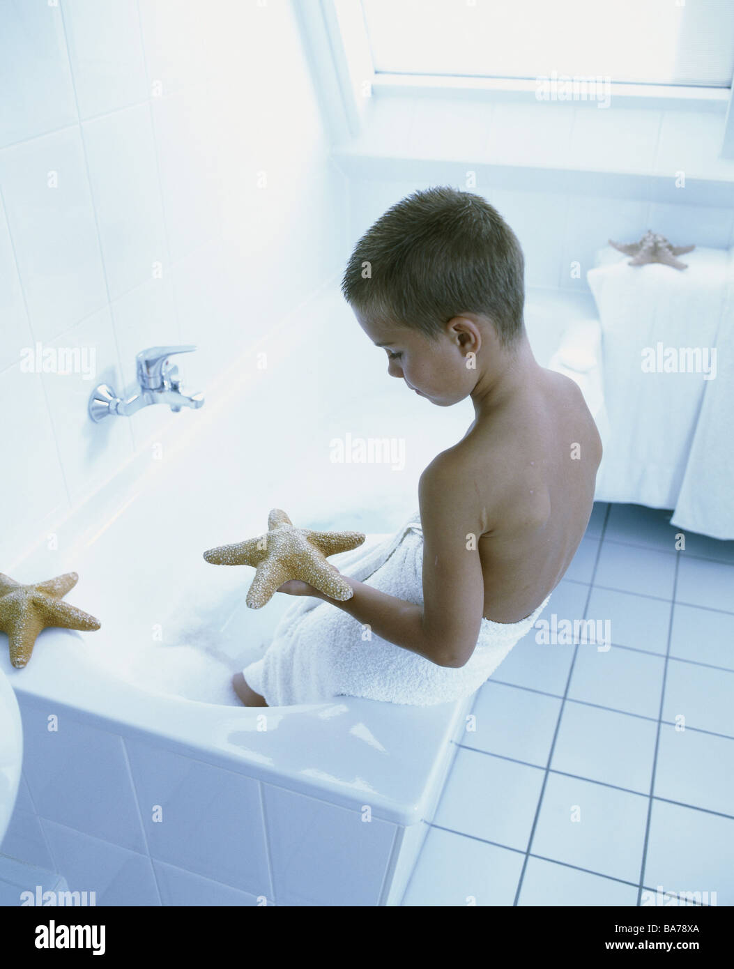 Give birth hip towel bathtubedge sits starfish artificially views back