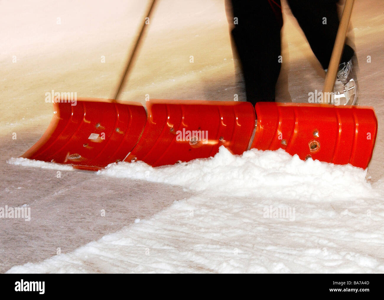 Ice-surface person snow-areas detail ice-skating-place ice skate-surface ice shovels red snow-racketeers snow push clears Stock Photo
