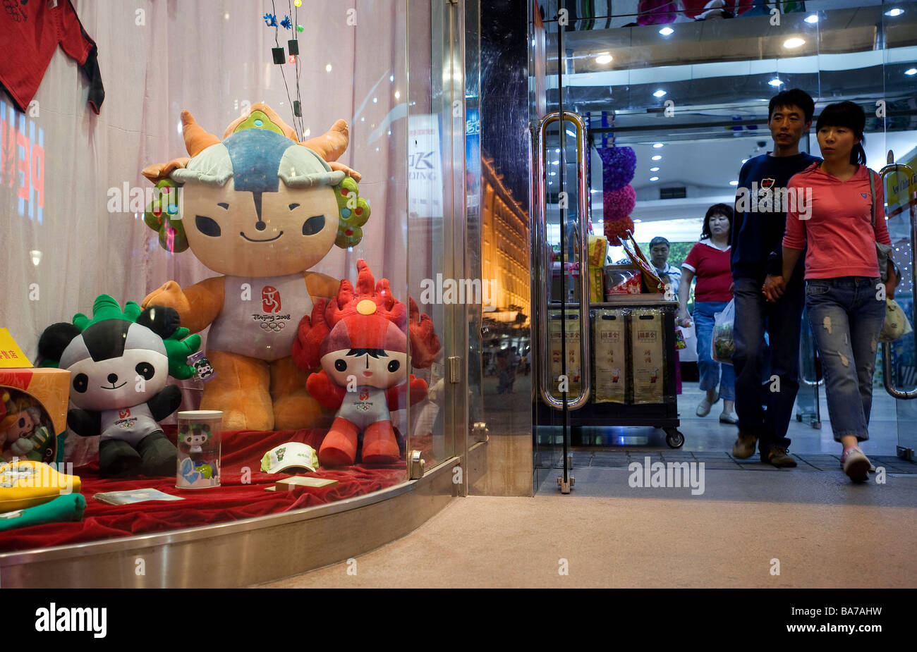 China, Beijing, 2008 Olympics mascots in a shopping mall on Wangfujing street,the green is Nini the swallow representing Stock Photo