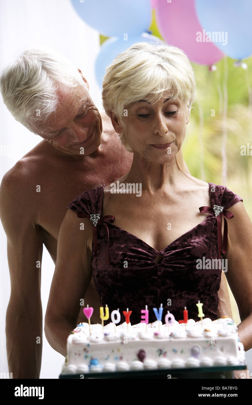 Senior-pair birthday-pie cheerfully semi-portrait series people 50-60 years 60-70 years seniors pair birthday anniversary Stock Photo