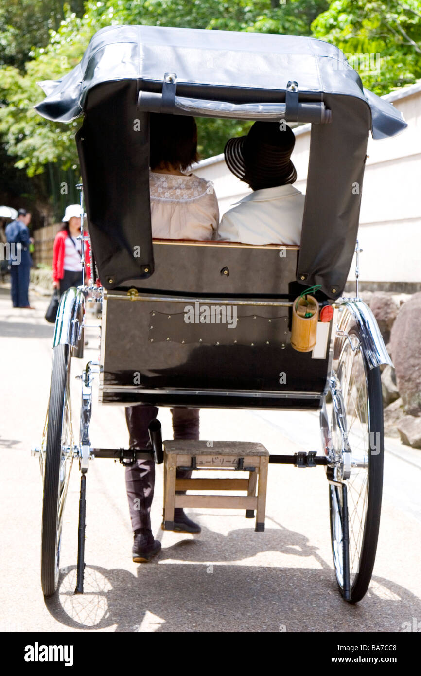 What's A Rickshaw Rickshaw with two persons Stock Photo - Alamy