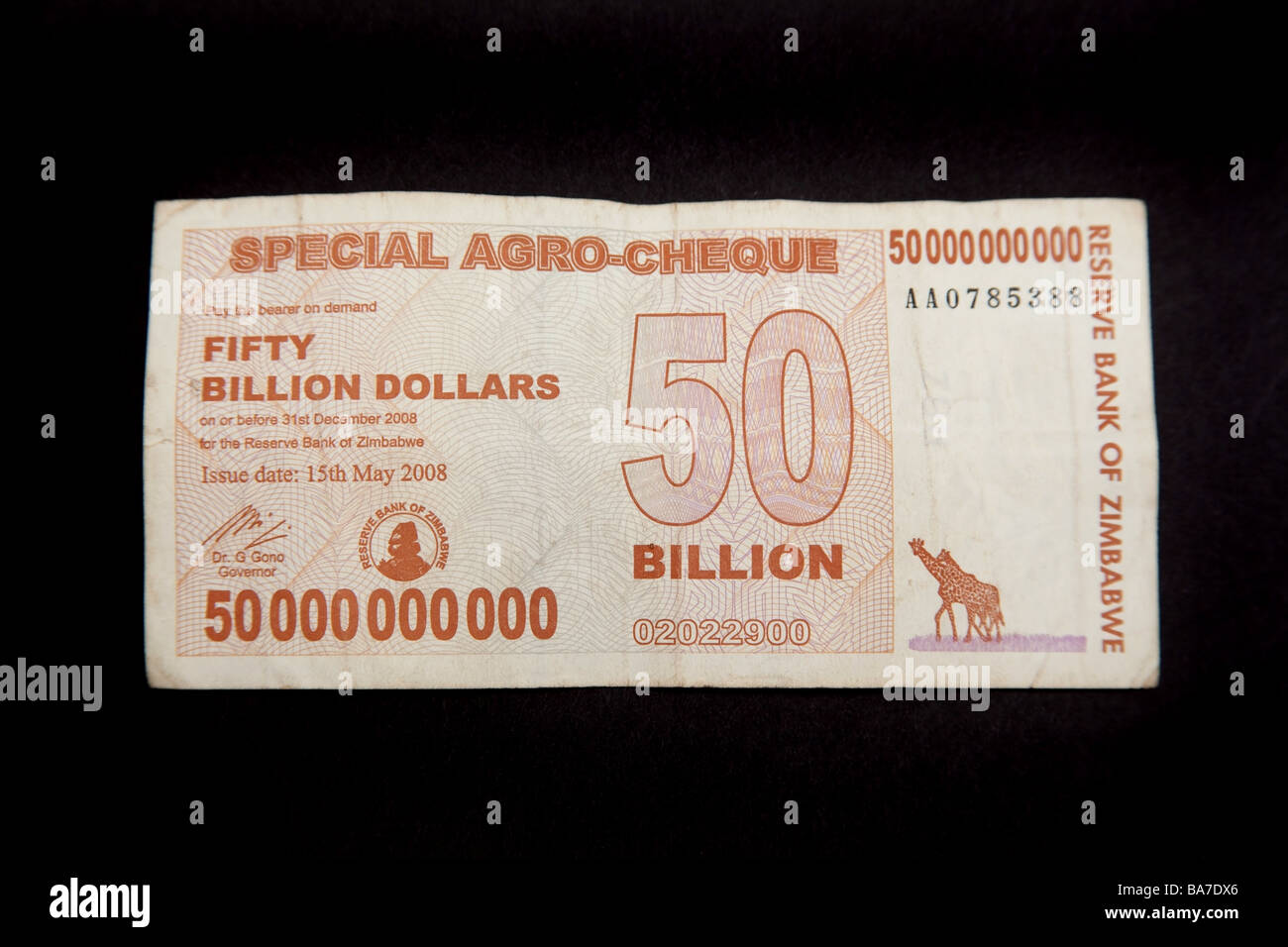 Zimbabwean 50 billion dollar note on a black studio background Stock Photo