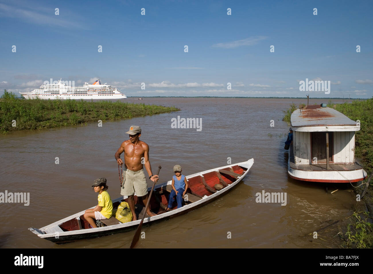 Amazonian Indian Family and MS Europa on a sidearm of the Amazon River,  Boca da Valeria, Amazonas, Brazil, South America Stock Photo - Alamy