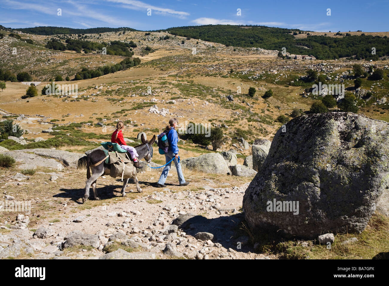Mother and child on a hiking tour, Family hiking trip with a donkey in the Cevennes mountains, Cevennen, France Stock Photo