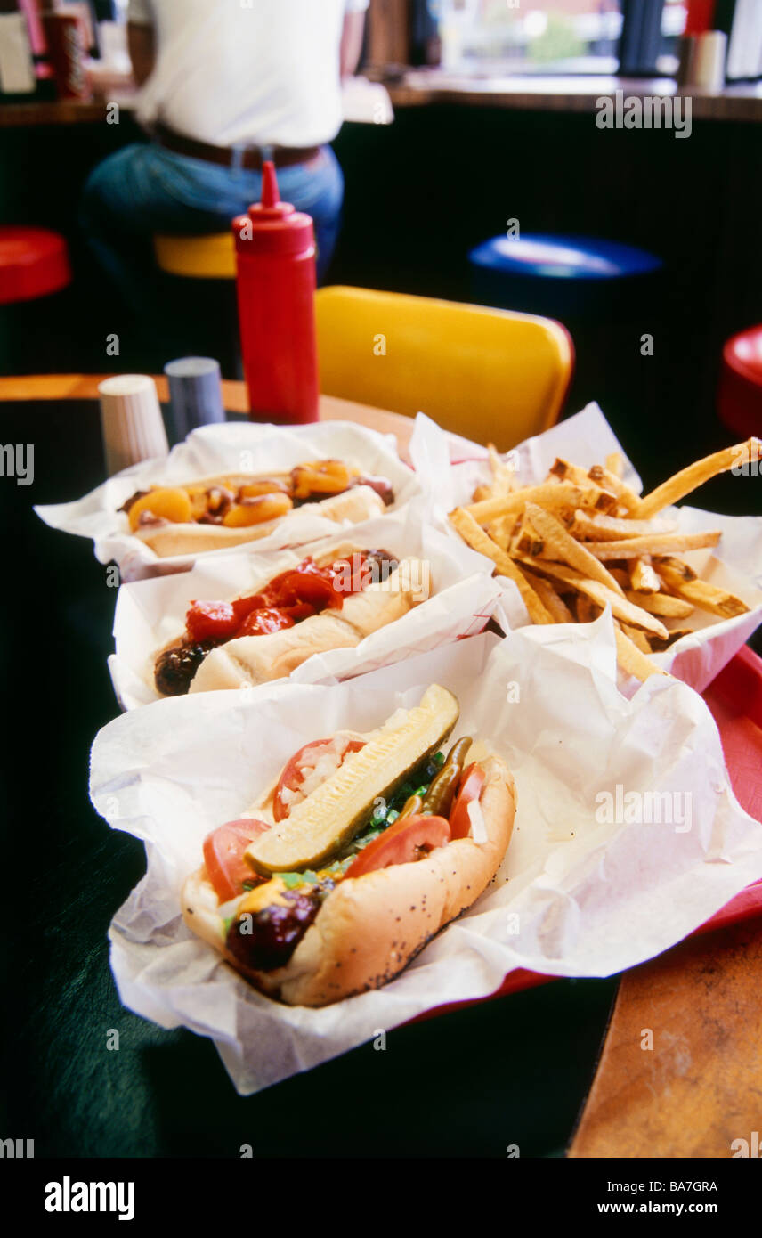 Three Hot Dogs and French fries in the Restaurant, Chicago, Illinois, USA, Chicago, Illinois, USA Stock Photo