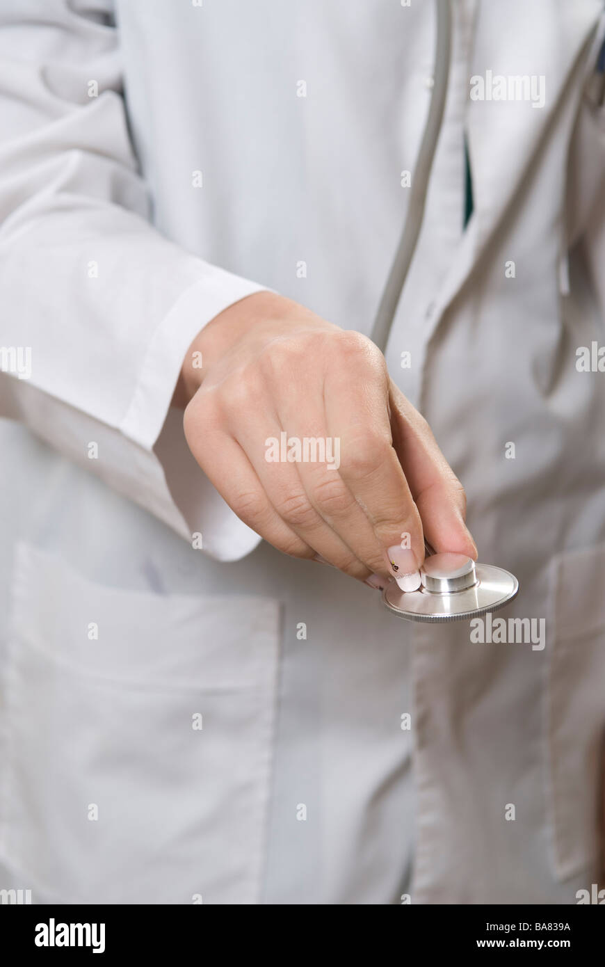 Doctor's hand holding stethoscope Stock Photo