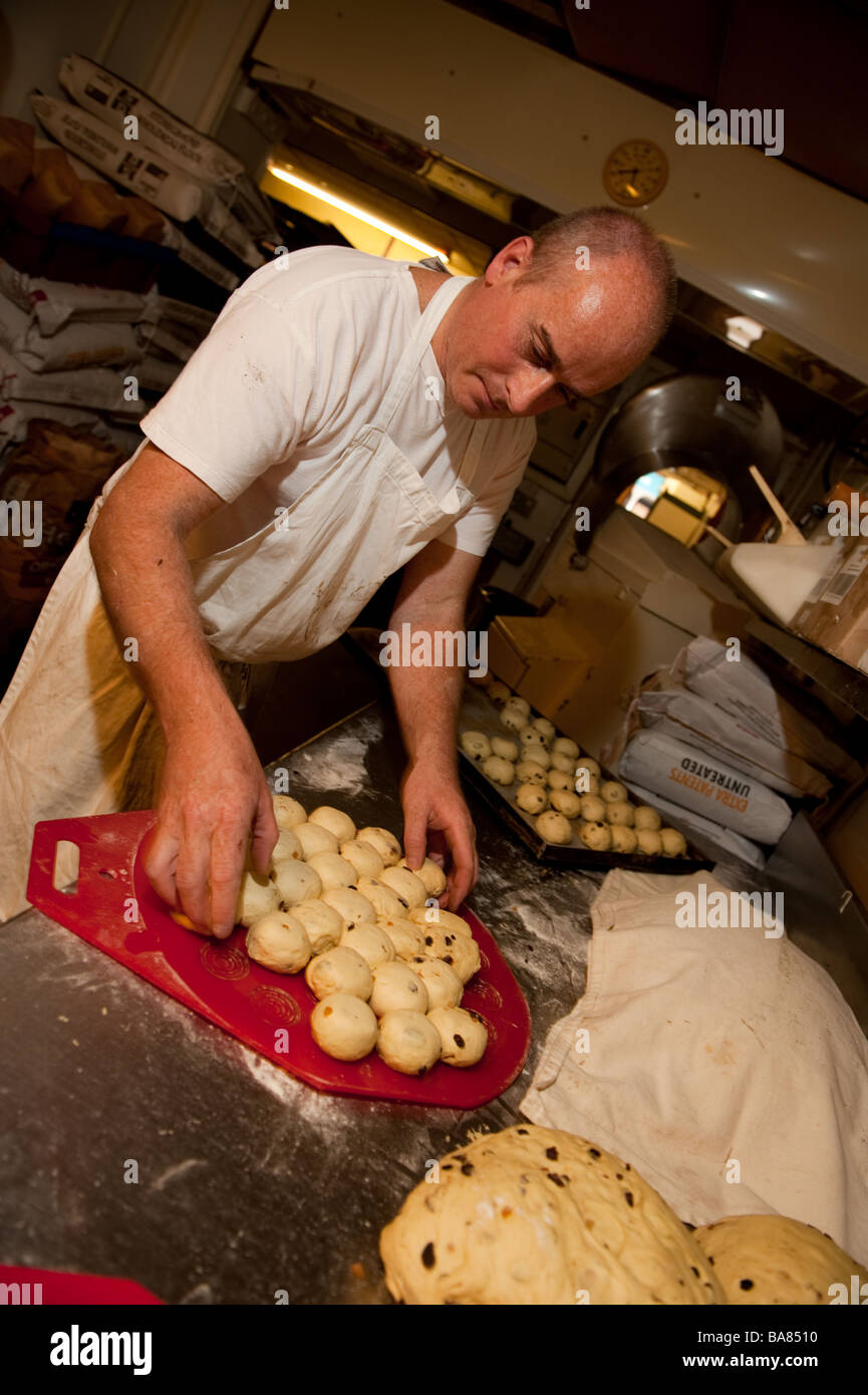 A baker making traditional hot cross buns for easter UK Stock Photo Alamy