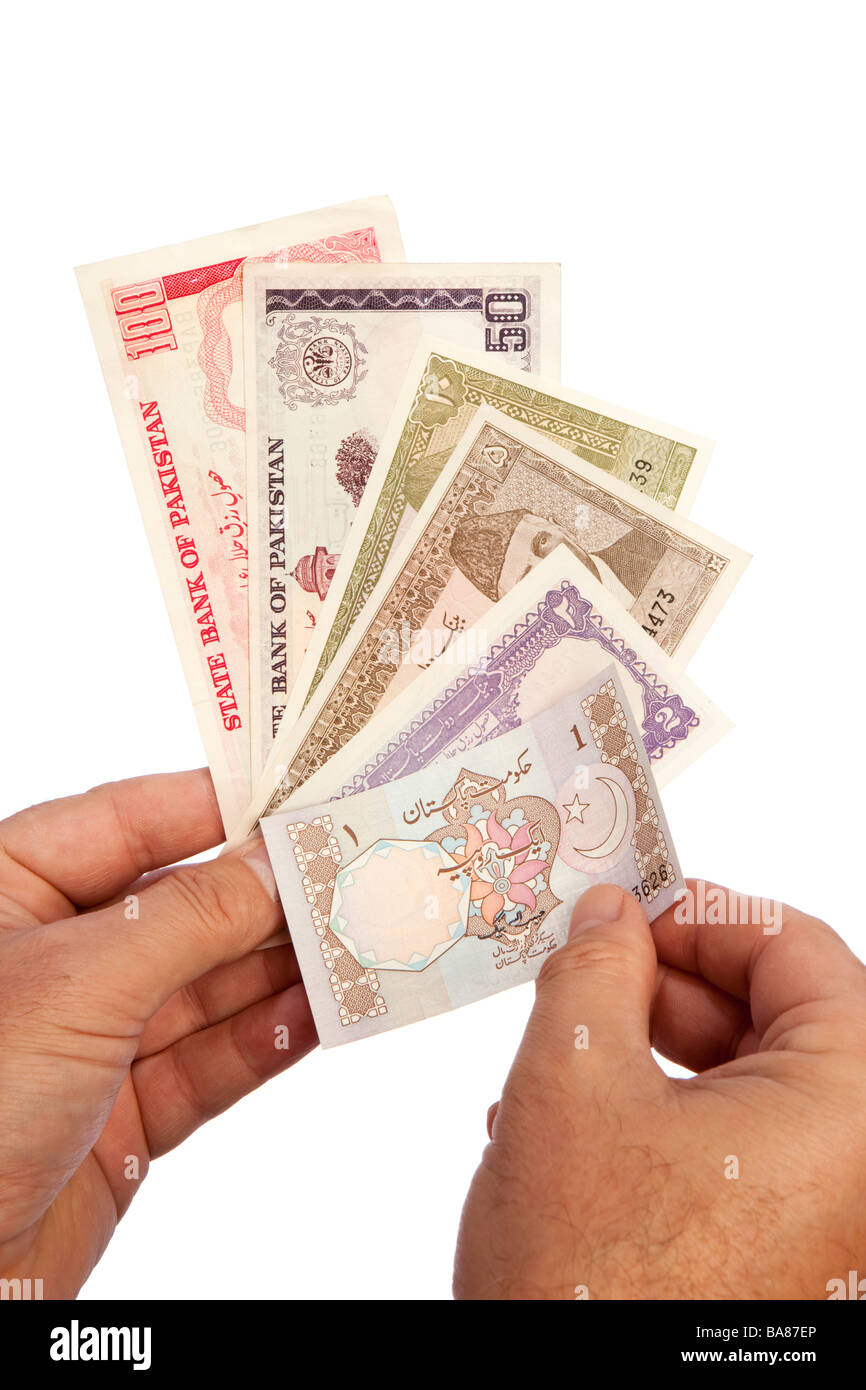 Money male hands holding handful of Pakistani currency Stock Photo