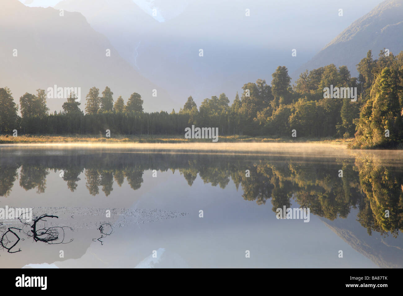 Southern Alps reflected in the  still water of Lake Matheson,Franz Josef,West Coast,South Island,New Zealand,Oceania Stock Photo