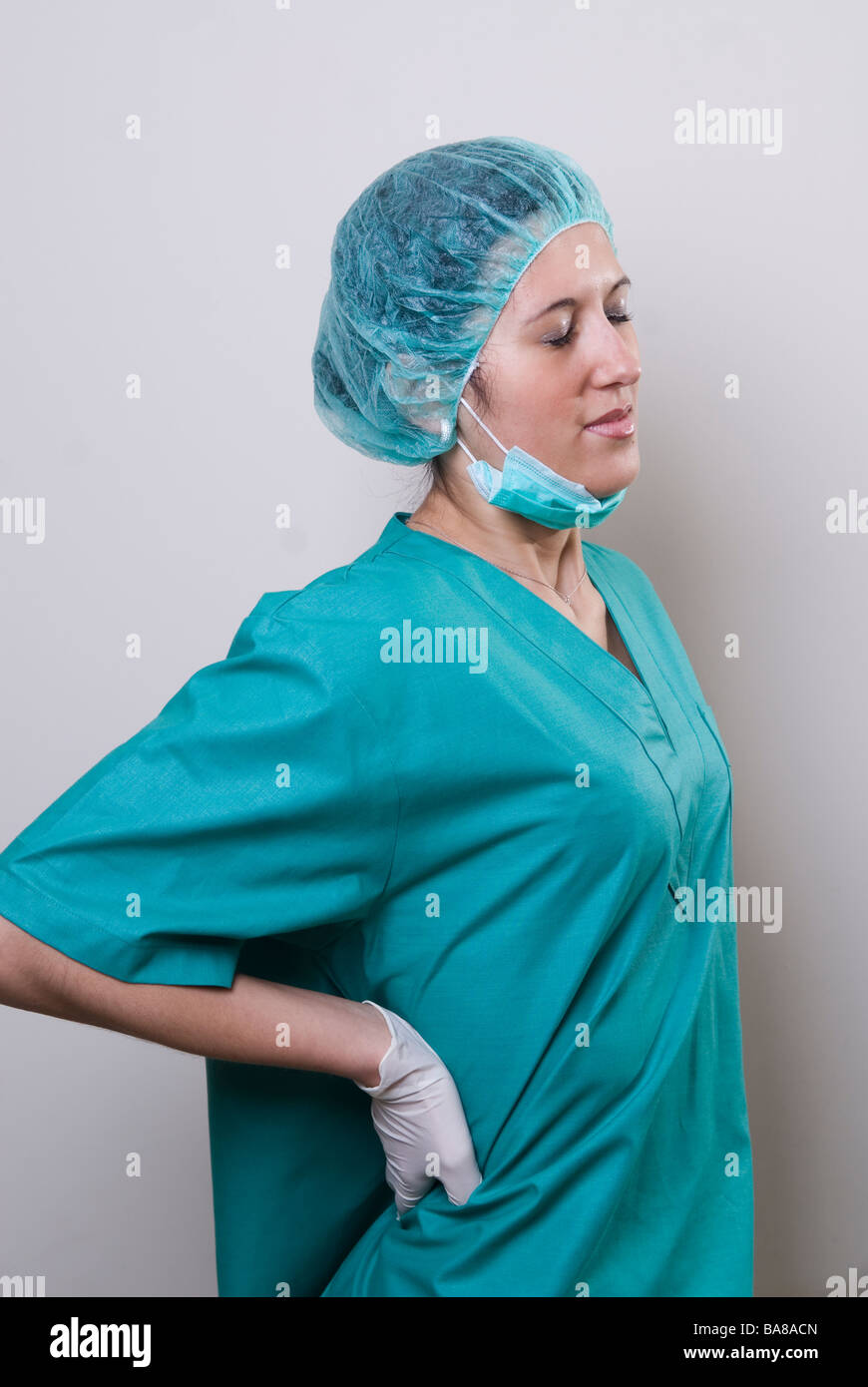 Tired nurse with backache Stock Photo