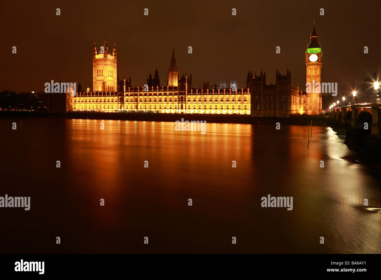 Houses of Parliament, Big Ben and Westminster Abbey across the River Thames at night, London, England, UK. Stock Photo