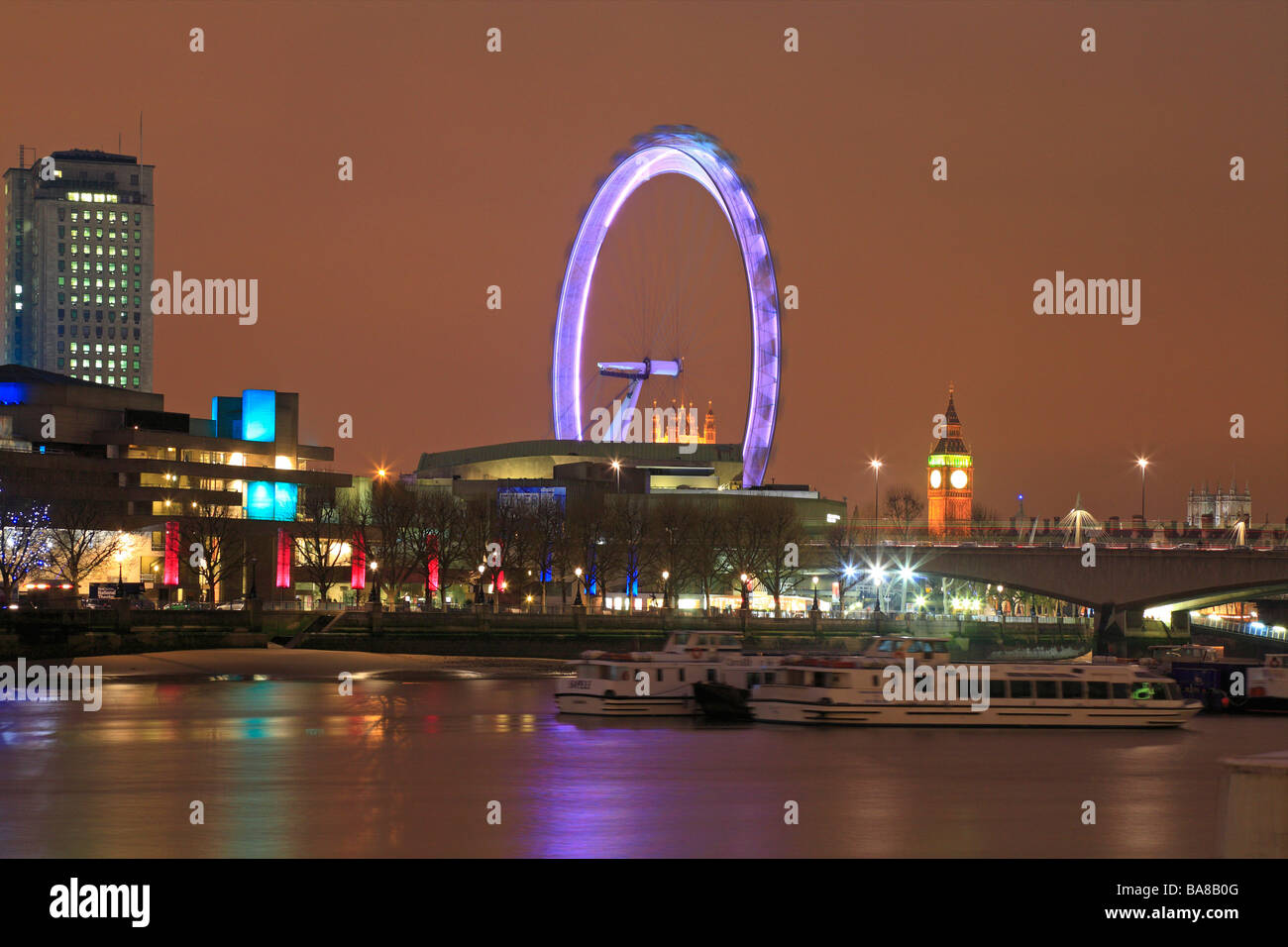 National Theatre, London Eye, Big Ben on the South Bank across the River Thames at night, London, England, UK. Stock Photo