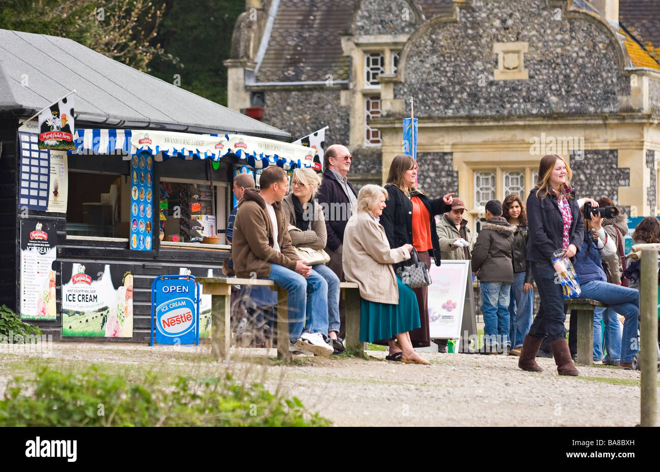 British people on holiday outside Ice cream kiosk in Arundel, West Sussex, UK Stock Photo