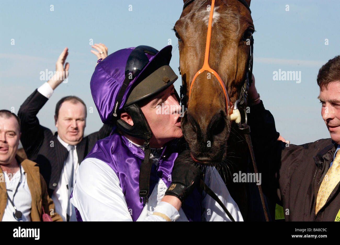 Jockey Barry Geraghty the winner of the Gold Cup kissing winning horse Kicking King at Cheltenham on the last day of the races Stock Photo