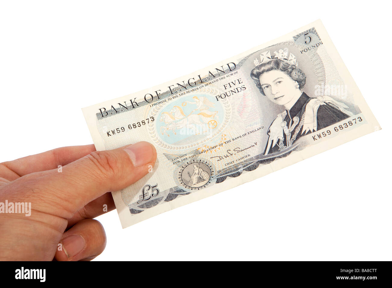 Money male hand holding old British five pound banknote Stock Photo