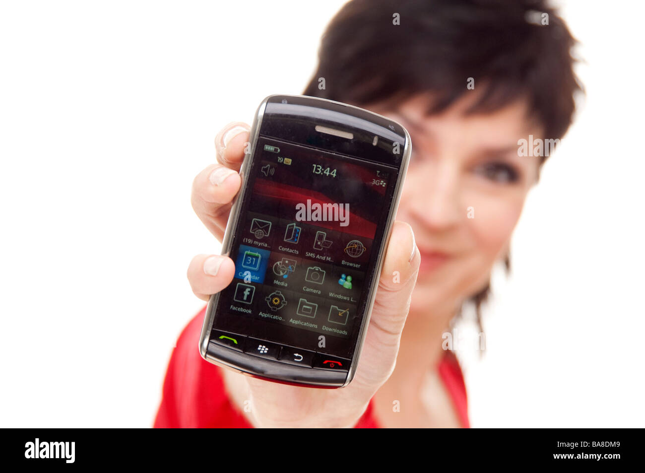woman holding up her blackberry mobile telephone Stock Photo