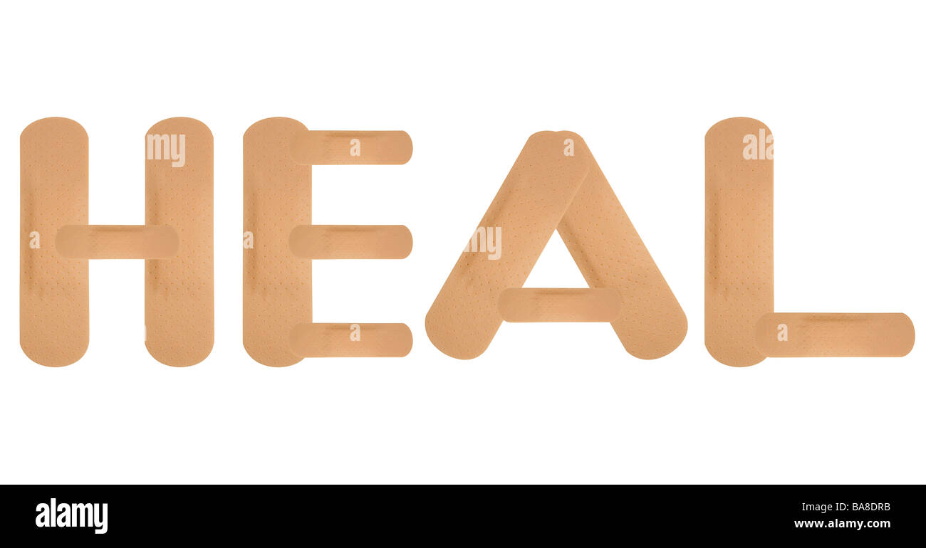 Plaster band aids spelling HEAL on white background Stock Photo