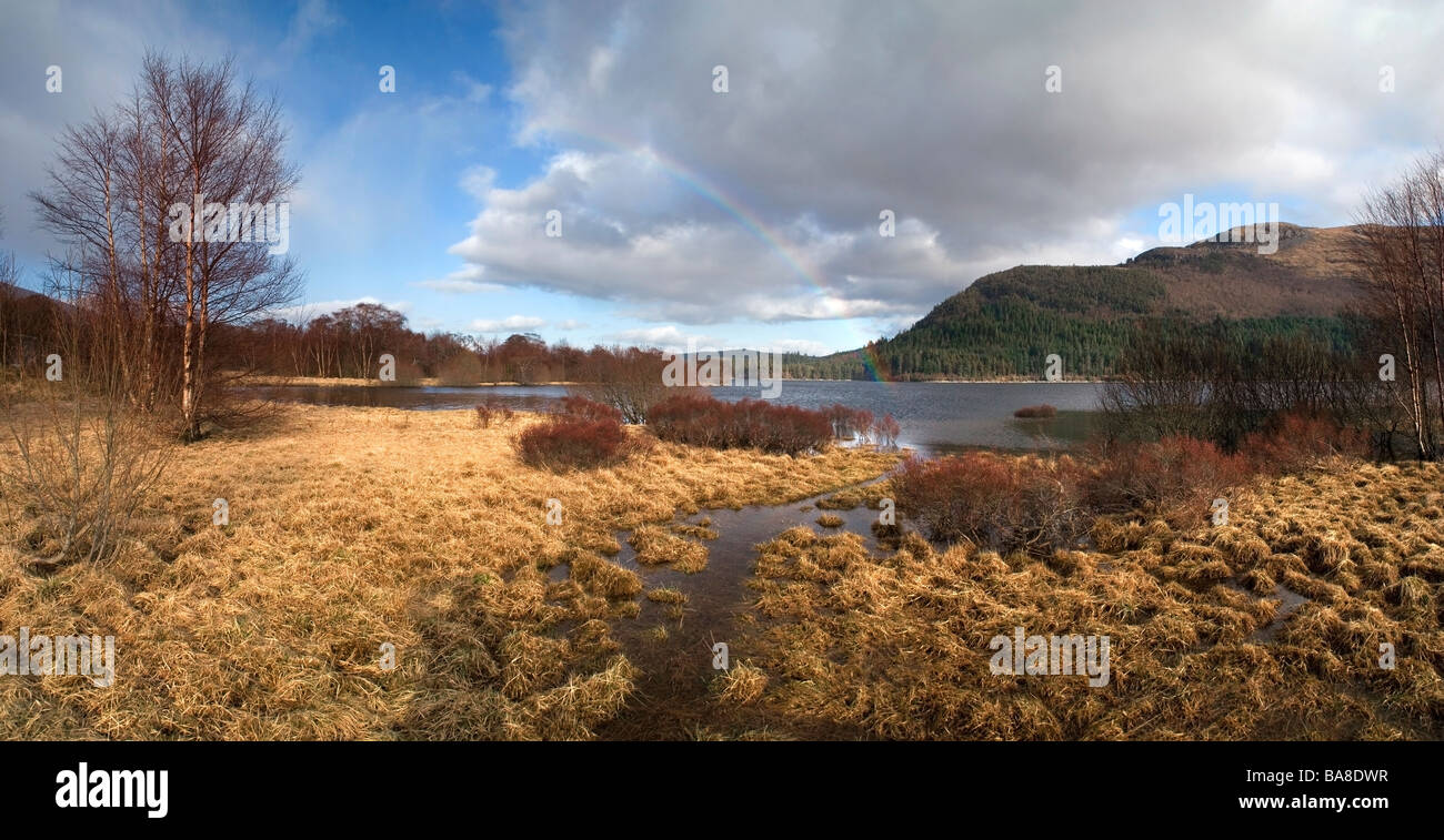 Loch Laggan and rainbow, Highlands, Scotland, UK Stock Photo