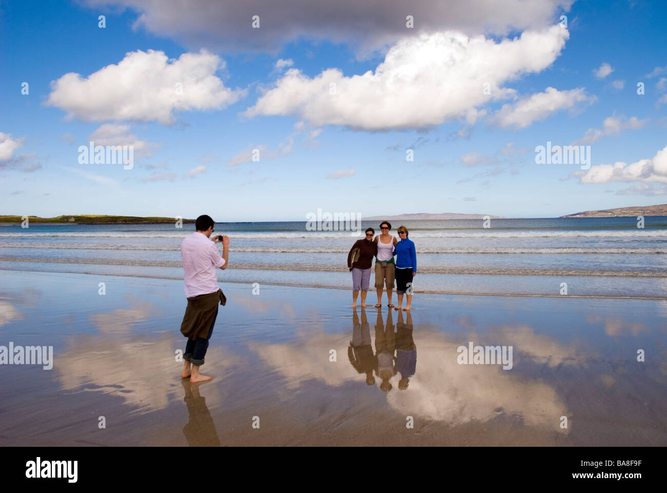Narin Ardara County Donegal Ireland Tourists take a digital photograph by the Atlantic Ocean Stock Photo