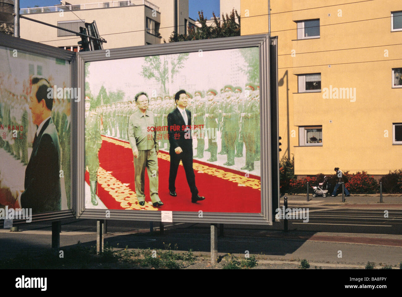 posters of The two Korean Kim s on Bernauer Strasse in Berlin Germany Stock Photo