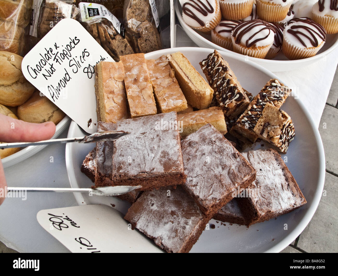 plates of Fresh locally produced home made food and cakes on sale at