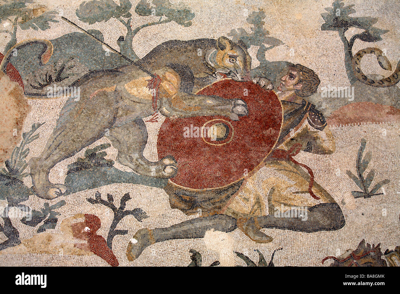 Mosaic of hunter fighting lioness in Villa del Casale, Piazza Armerina, Sicily, Italy Stock Photo