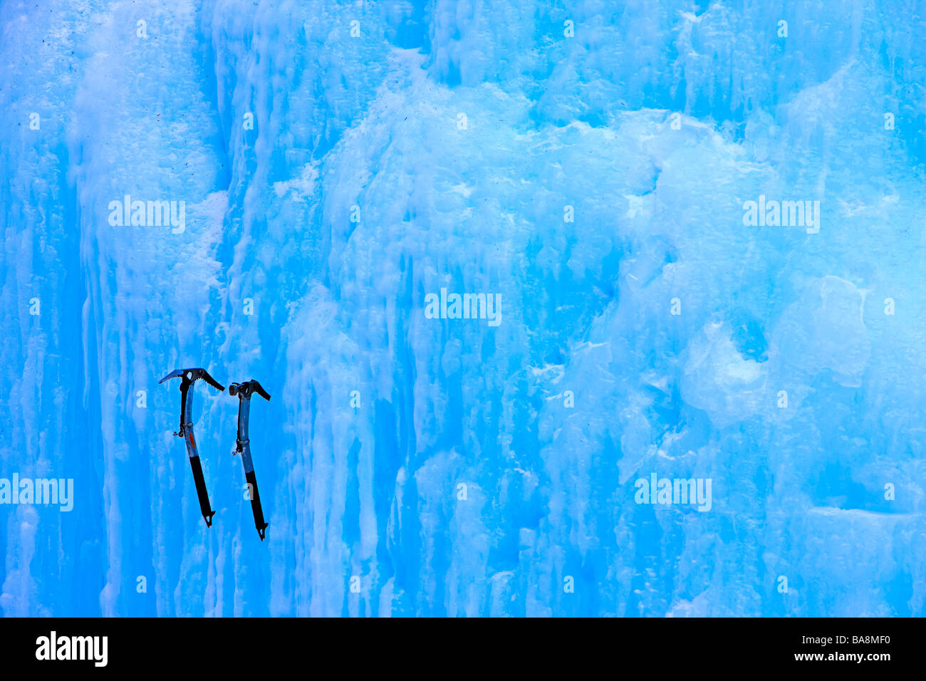 Two ice picks lodged in a wall of ice Stock Photo Alamy