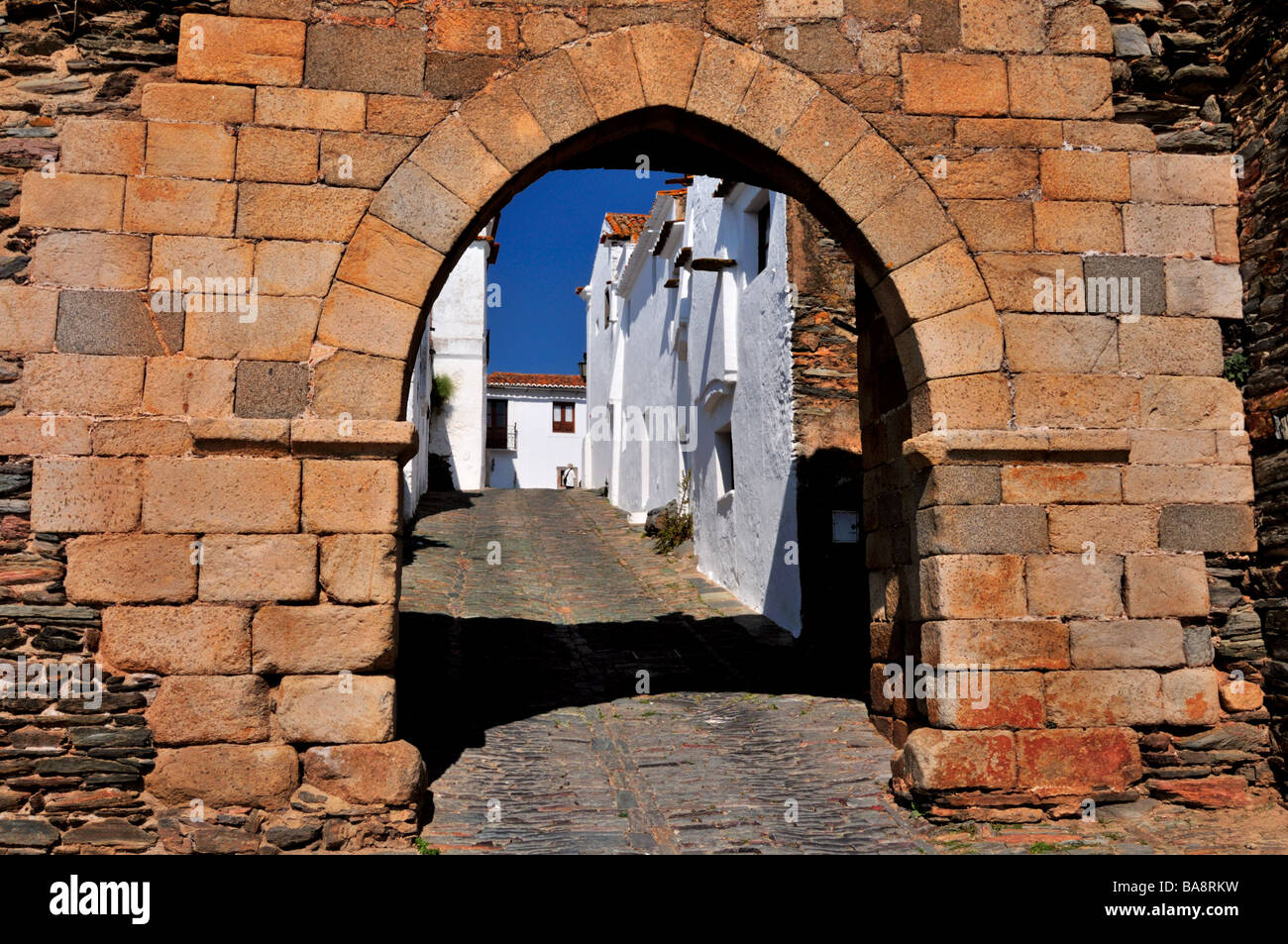 Medieval town entrance Porta de Alcoba and alley Travessa Dom Dinis in Monsaraz Stock Photo