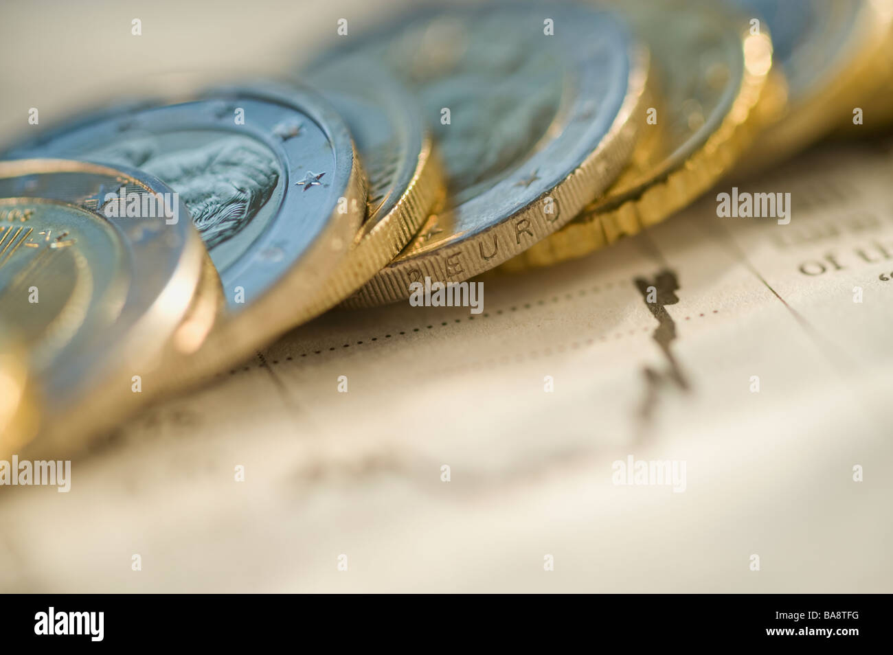 Euro coins on financial graph Stock Photo