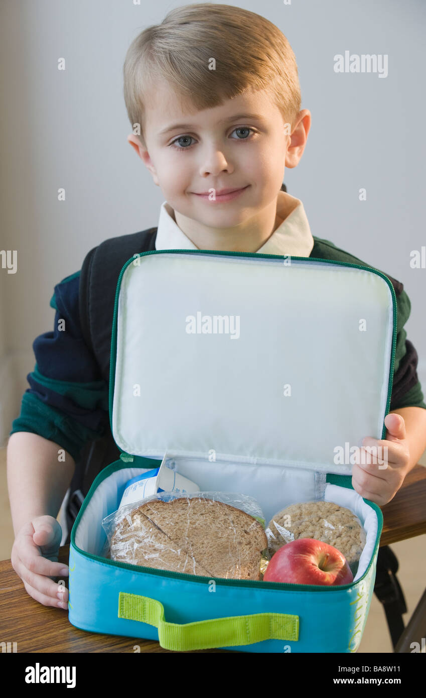 Boy with lunch box Stock Photo