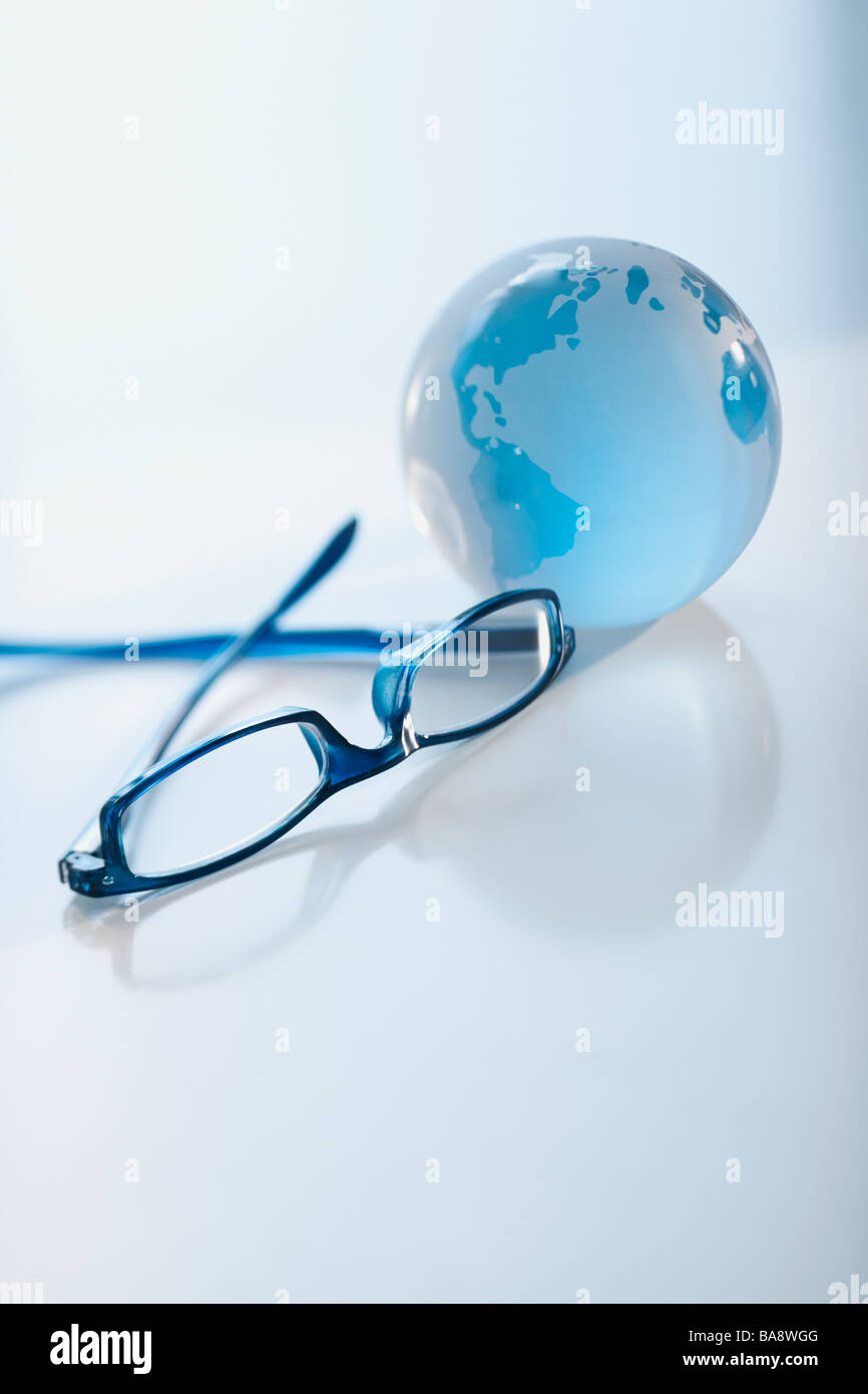 Eyeglasses and globe Stock Photo