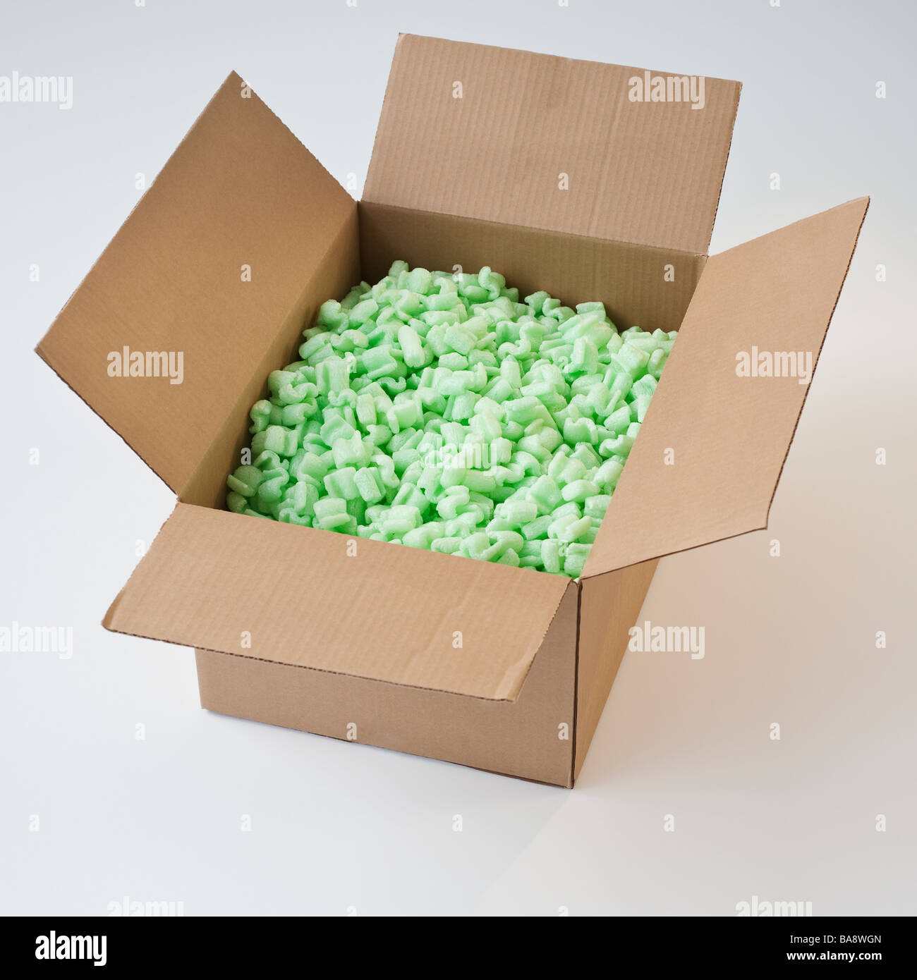 Packing peanuts in cardboard box Stock Photo