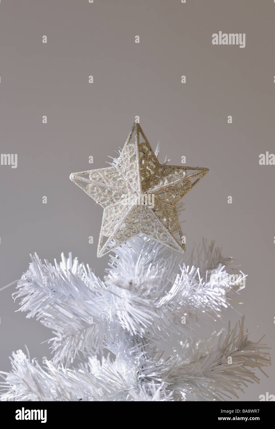 Star on artificial Christmas tree Stock Photo