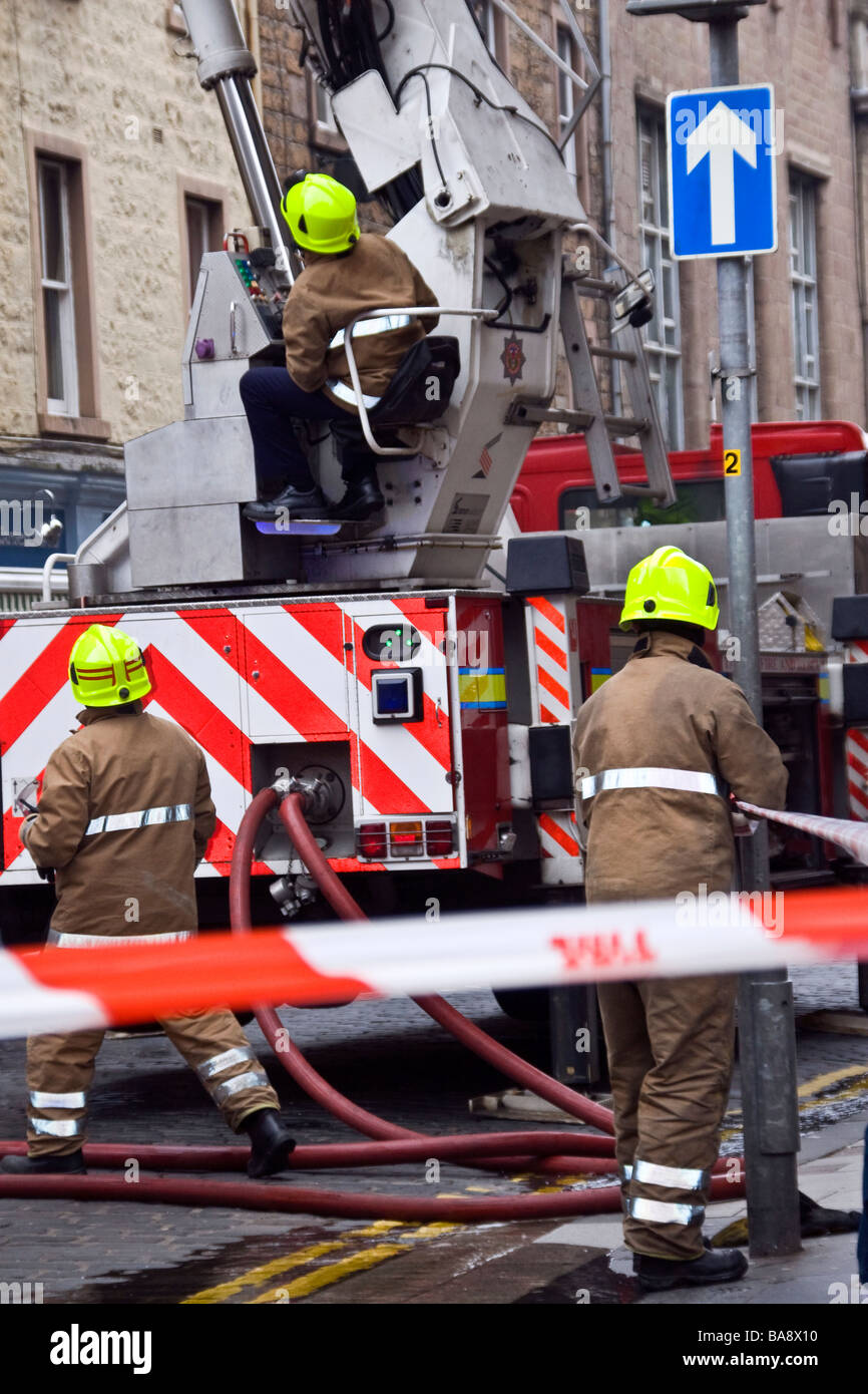 Scottish Fire and Rescue Service Fire engine attending to a shop fire along Castle Street in Dundee, UK Stock Photo