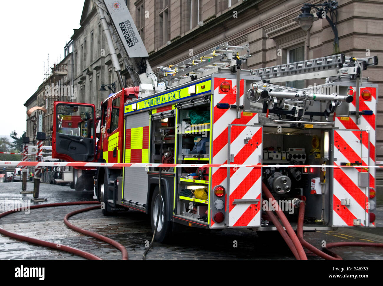 Scottish Fire and Rescue Service Fire engine attending to a shop fire along Castle Street in Dundee, UK Stock Photo