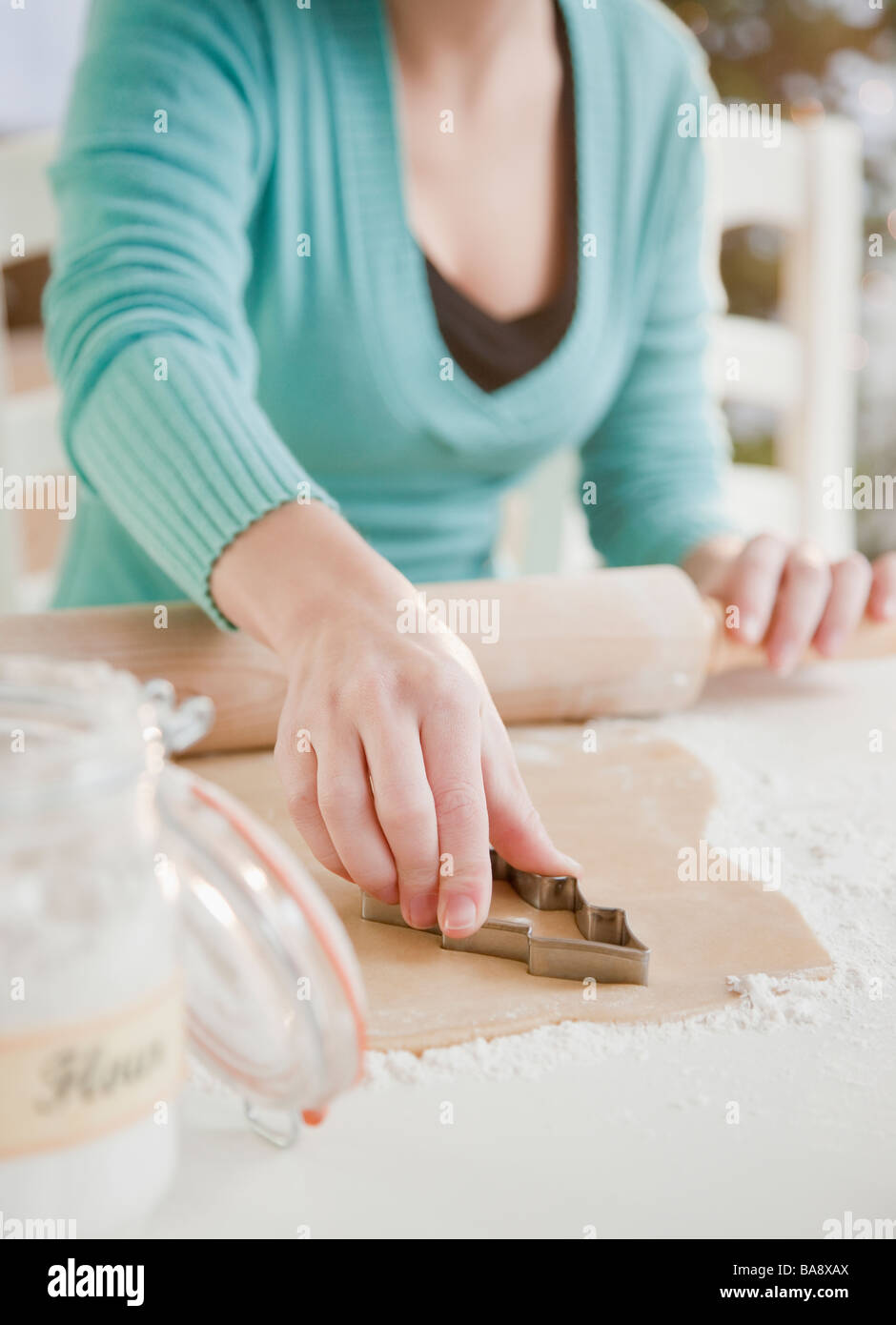 Woman making Christmas cookies Stock Photo