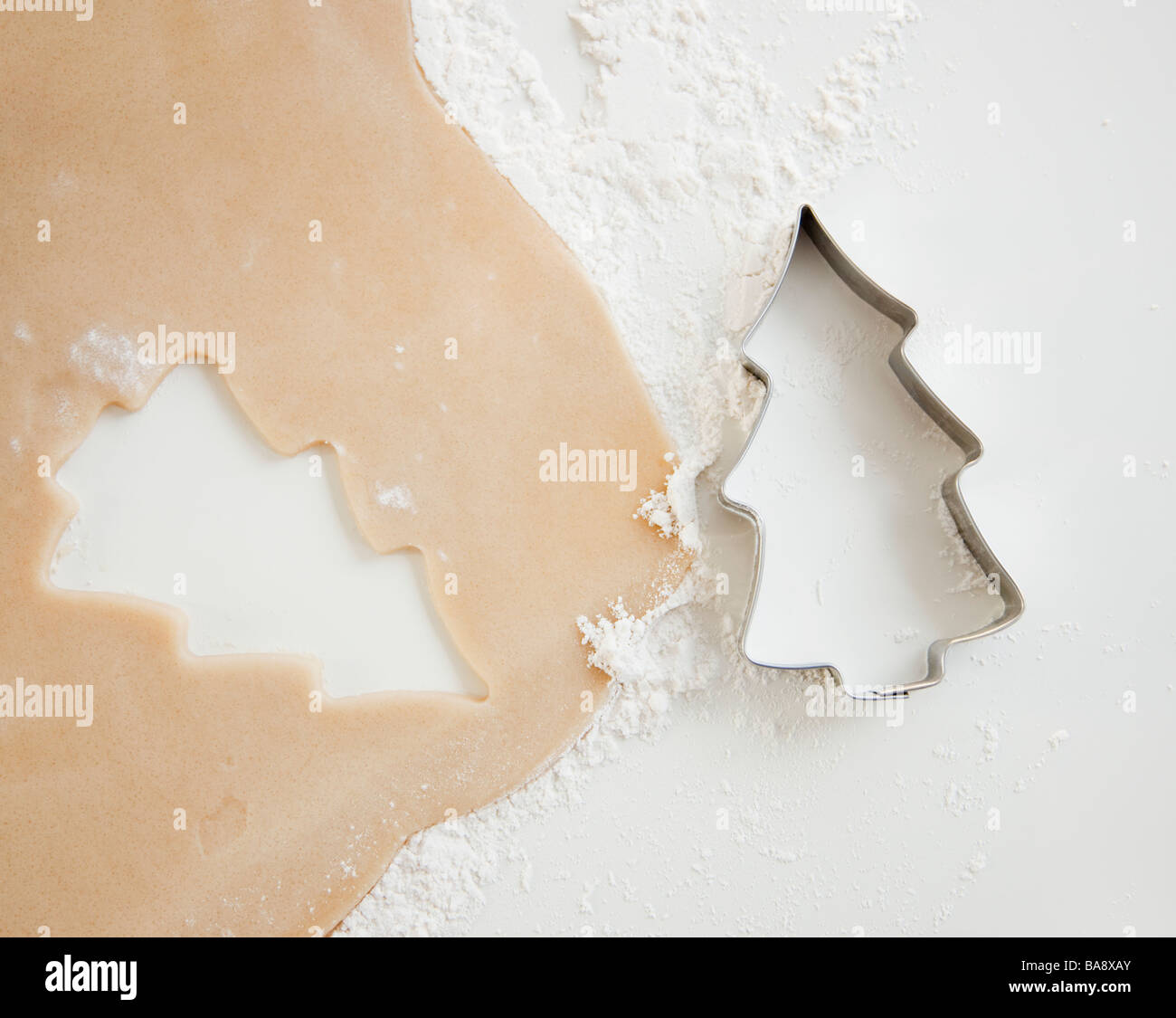 Christmas cookie cutter and dough Stock Photo
