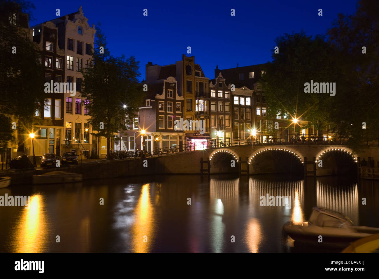 Bridge over the Singel canal in Amsterdam at night Stock Photo