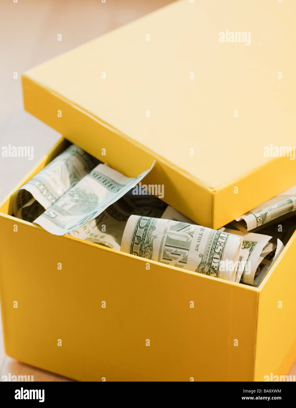 Box full of paper money Stock Photo